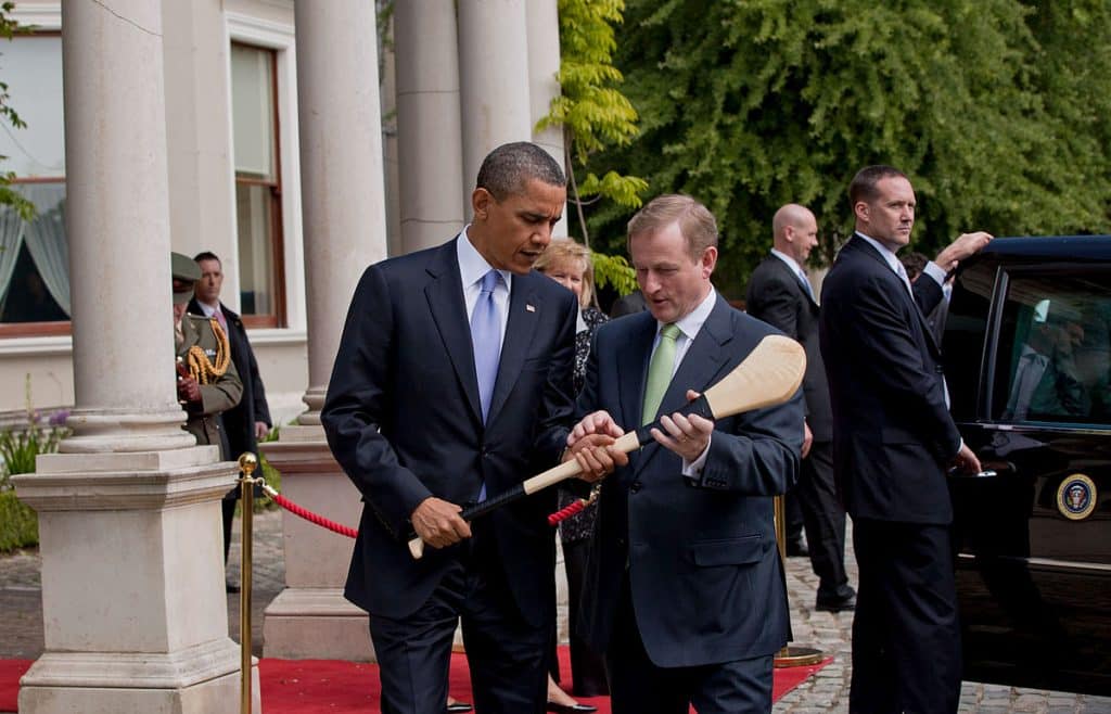 Former Taoiseach Enda Kenny presents former President Barack Obama with a hurl.