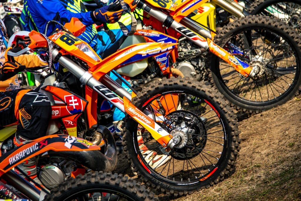 Motocross drivers must navigate challenging terrain filled with bumps, obstacles and tight corners.