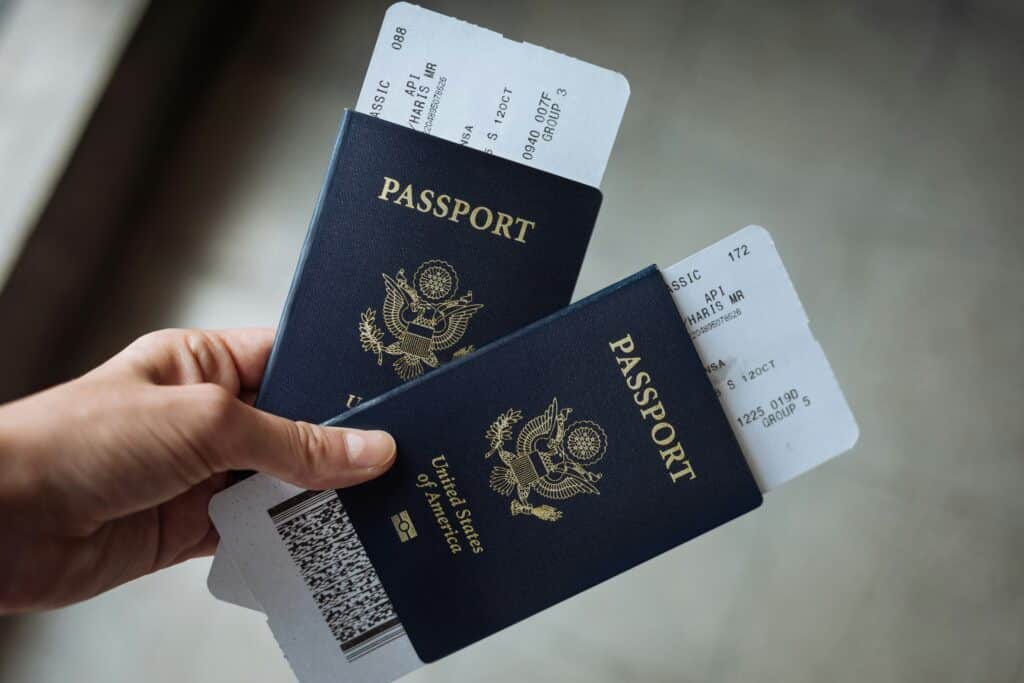 Two US passports with boarding passes. Ryanair made news headlines for charging an elderly couple £55 each to print off their boarding passes.