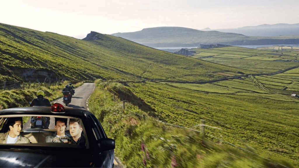 Ross, Chandler, and Gary from Friends driving through the Irish countryside.