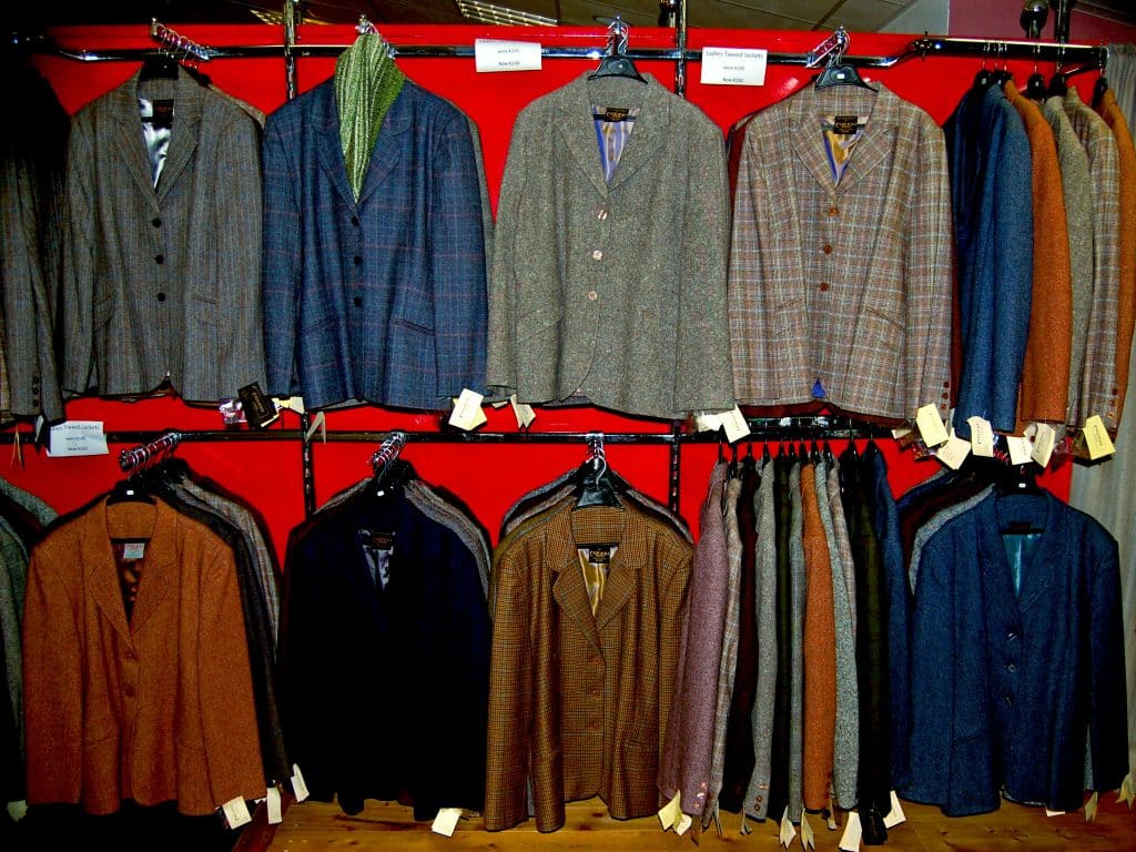 Donegal tweed jackets on display at a trade show.