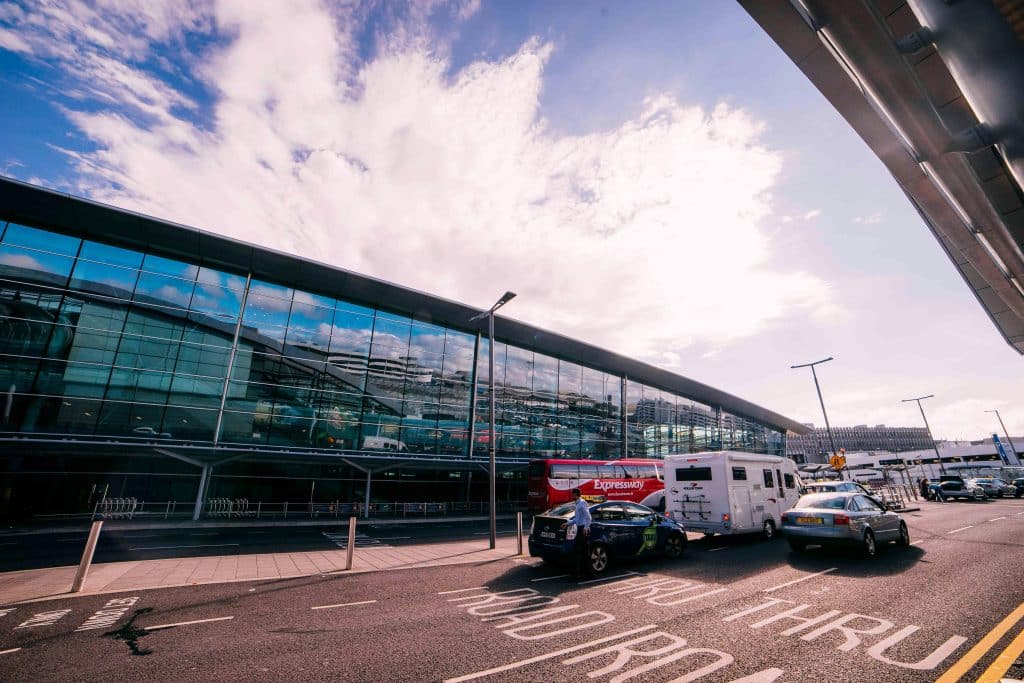 Dublin Airport's Terminal 2 and the adjacent road on a bright day.