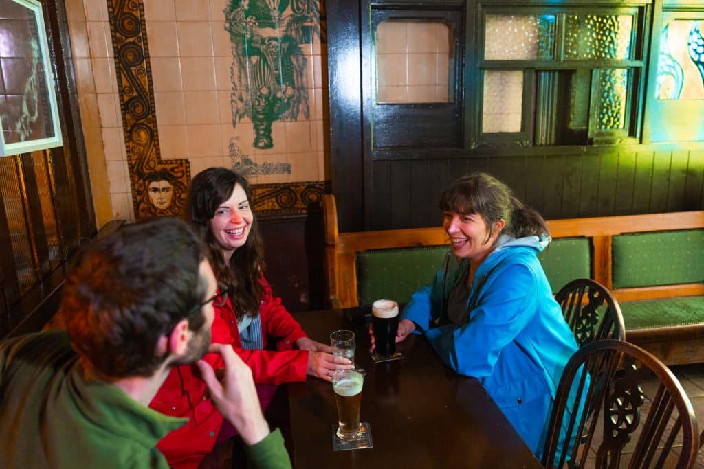 3 Patrons enjoying a pint in the Shoot the Crows, Pub, Sligo Town, Co. Sligo.