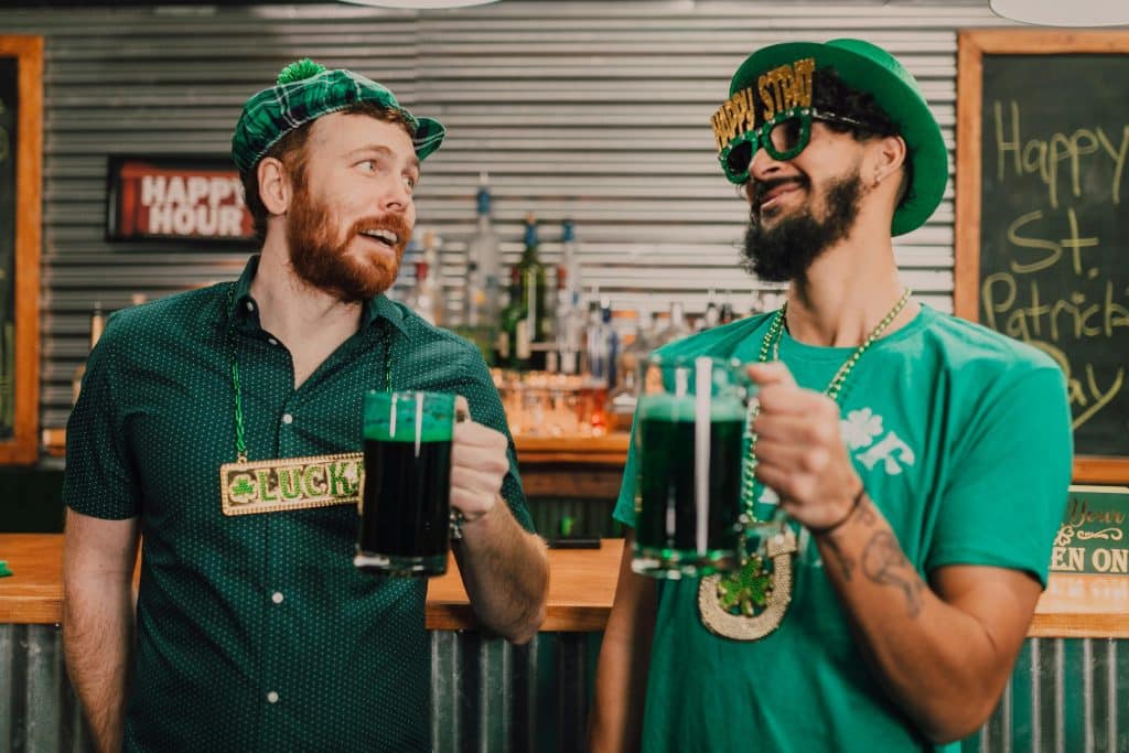 Two stereotypically ‘Irish’ men with green beer.