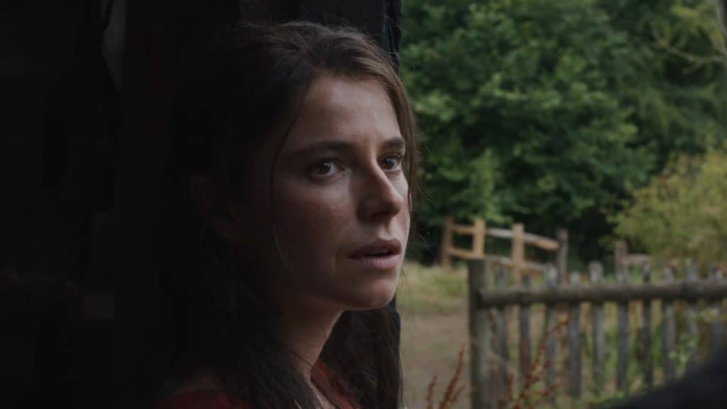 A still of Jessie Buckley from Hamnet.
