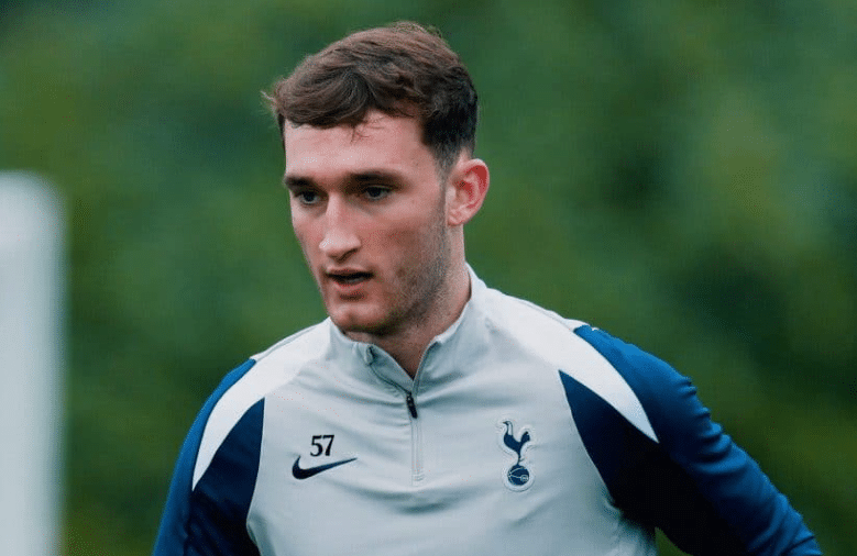 A focused Mason Melia during a training session wearing a grey Tottenham Hotspur quarter-zip top.