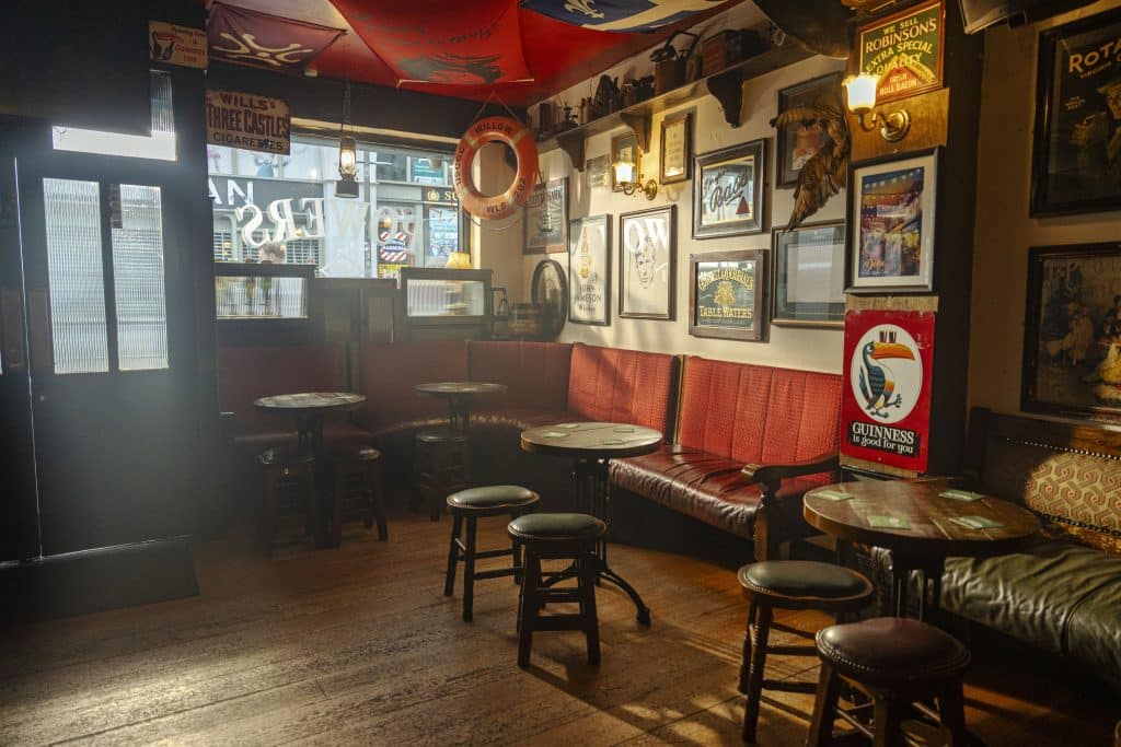 The corner of an old Irish pub with Guinness memorabilia. 