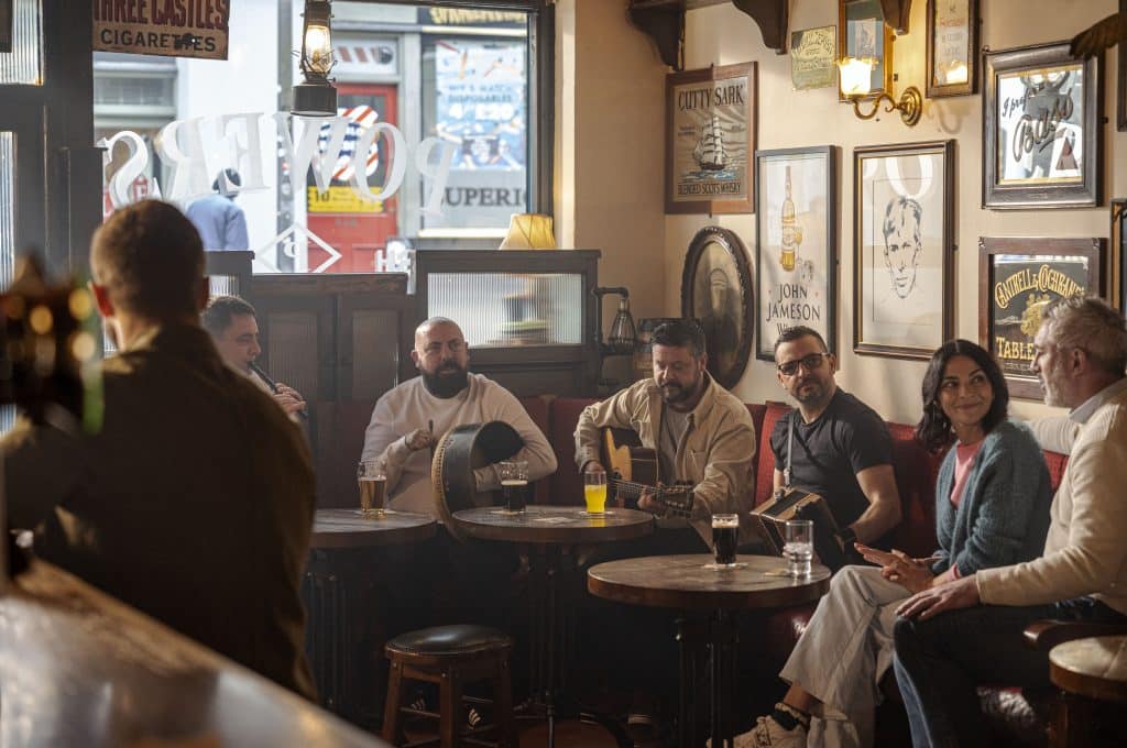 An Irish music session in the corner of a pub.