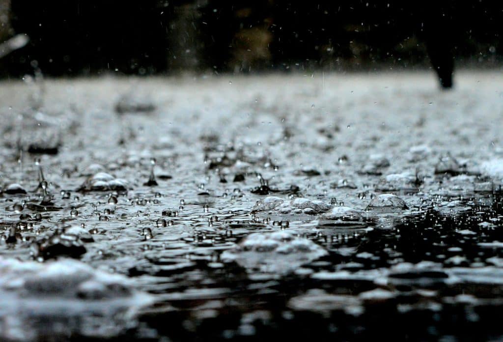 Close-up of splashing rain on the street.