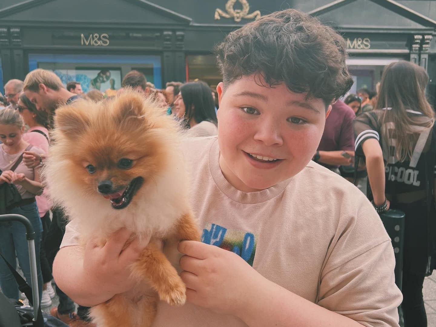 Irish artist holding a dog (Roe Byrne).